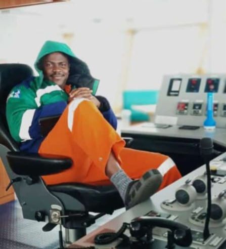 A crew member relaxing at the vessel's control console